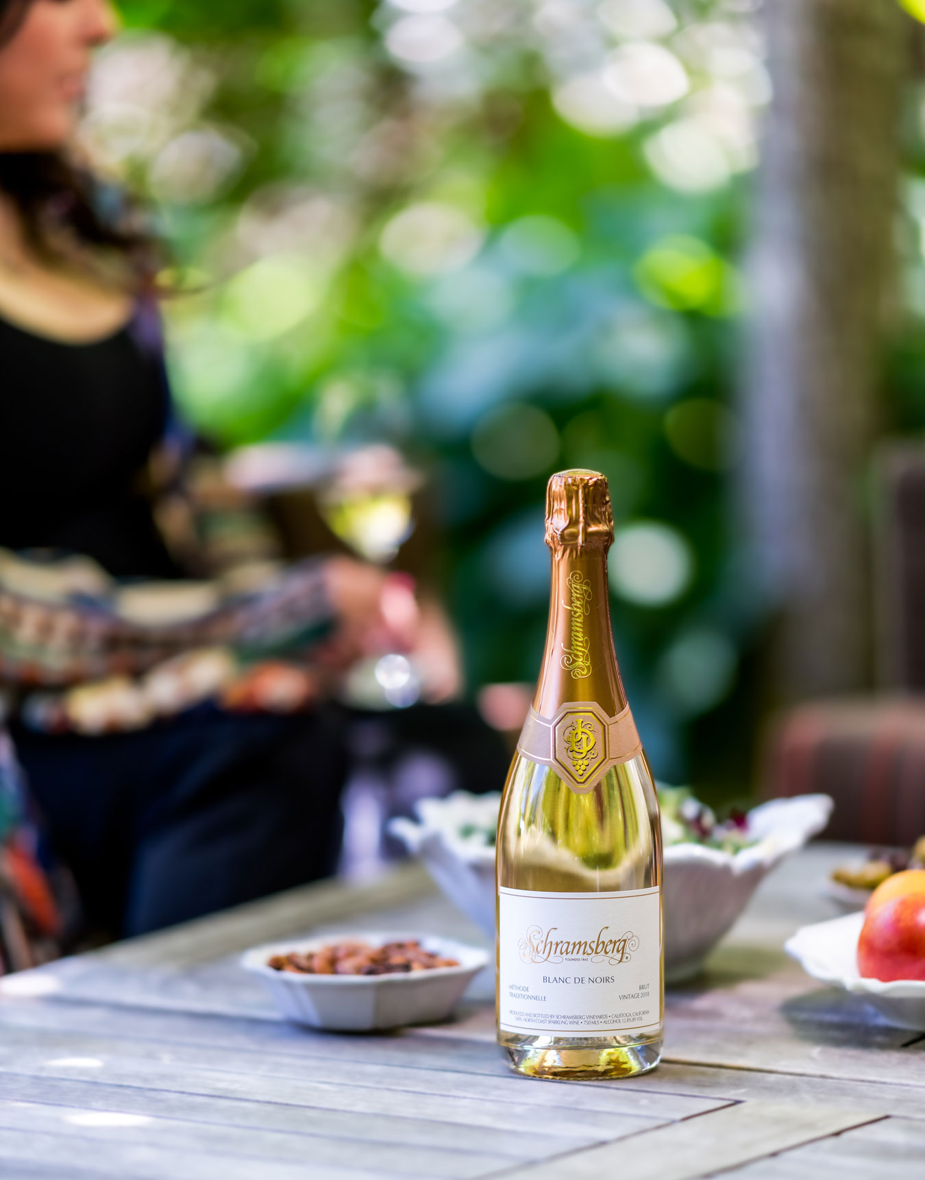Schramsberg Wine on a table in a garden setting